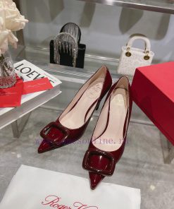 This Viv'Coc Lacquer Buckle High Heel is handmade in shiny patent leather, embellished with wpd2ror2