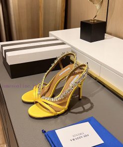 Aquazzura 2024This is a rhinestone sandal with a bohemian charm, featuring a free spirited srtnmmbnr