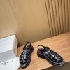 Sandro, a pair of impeccable Roman sandals with large gold teeth and thick soles, is a new snypyjcr0
