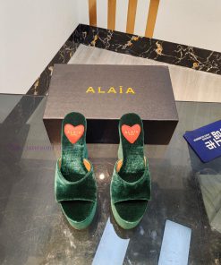 ALAIA's latest hate sky high water table slippers for 2024, with a unique heart-shaped desigledxc39o