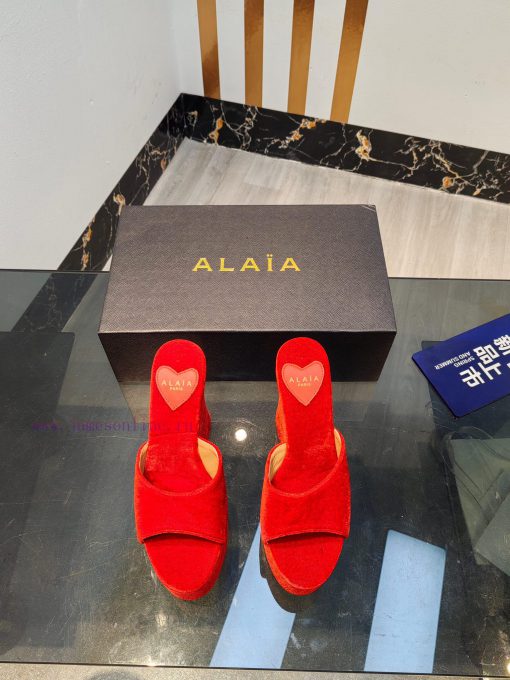 ALAIA's latest hate sky high water table slippers for 2024, with a unique heart-shaped desigoooqw299