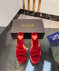 ALAIA's latest hate sky high water table slippers for 2024, with a unique heart-shaped desigbuxoruvy