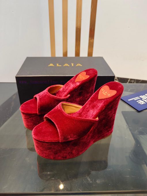 ALAIA's latest hate sky high water table slippers for 2024, with a unique heart-shaped desigbuxoruvy - Image 4