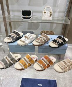 Prada slippers feature a soft lining and an iconic triangular logo, showcasing a unique binaxoh1q2qy