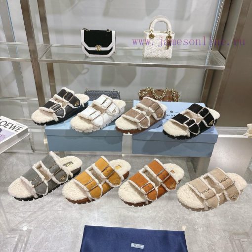 Prada slippers feature a soft lining and an iconic triangular logo, showcasing a unique binaalrkwdar