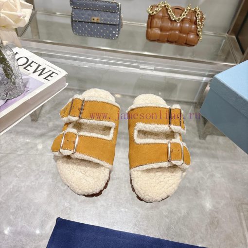 Prada slippers feature a soft lining and an iconic triangular logo, showcasing a unique binaalrkwdar - Image 2