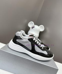 Prada Top Edition SneakersImported fly woven fabric with stitched patent leather on the uppek3v02fde