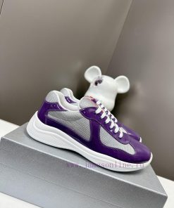 Prada Top Edition SneakersImported fly woven fabric with stitched patent leather on the uppeda4tofxa