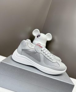 Prada Top Edition SneakersImported fly woven fabric with stitched patent leather on the uppe0a2elpi7