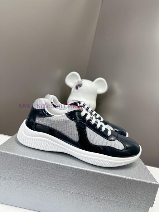 Prada Top Edition SneakersImported fly woven fabric with stitched patent leather on the uppera5vyvtj