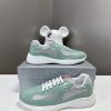 Prada Top Edition SneakersImported fly woven fabric with stitched patent leather on the uppem0cc6ln0