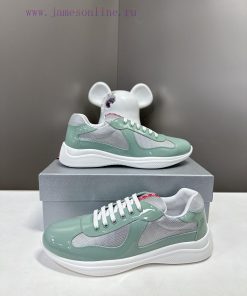 Prada Top Edition SneakersImported fly woven fabric with stitched patent leather on the uppem0cc6ln0
