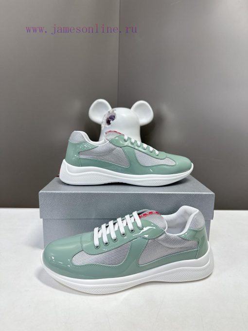 Prada Top Edition SneakersImported fly woven fabric with stitched patent leather on the uppem0cc6ln0