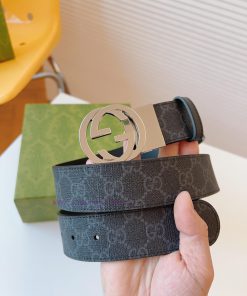 GUCCI's double-sided leather belt cleverly blends GG Supreme canvas with black leather mater m7m9uy6l