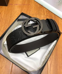 Gucci, double-sided belt, with Gucci Signature leather on one side and monochrome leather on mikxmwwl