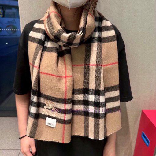 Burberry's classic cashmere plaid scarf with short beard edge is a must-have for the fragranghlst8ho