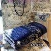 This shawl is a collaboration between Dior and artist Kenny Scharf, crafted from blue and piz9ovc298