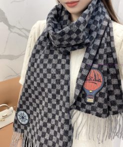 The Damier Graphite 12 Letters Petit Damier scarf is made of wool knit fabric and features aqyuiwllr