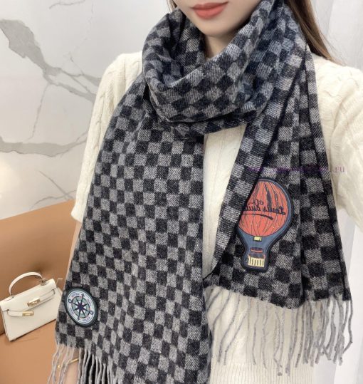 The Damier Graphite 12 Letters Petit Damier scarf is made of wool knit fabric and features aqyuiwllr