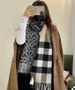 The dark gray double-sided scarf features the latest Tb print on one side and a classic checnh94q7kf