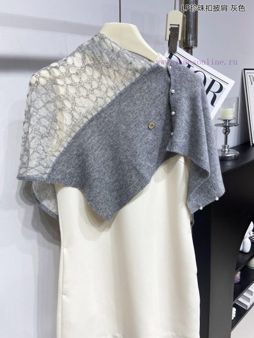 The new Loro Piana Cattle LP Pearl Button Shawl is a multifunctional shawl that can be wrappriwvr4ww - Image 7